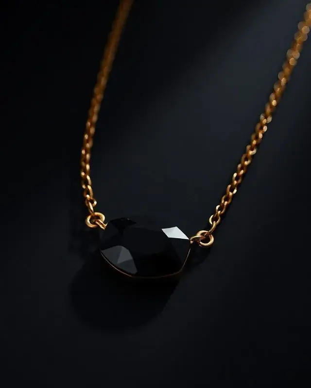 YSNNOIR featured luxury accessories piece 2 — black and gold collection