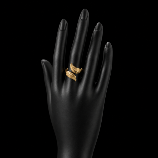 Gold double wing open ring on black hand mannequin