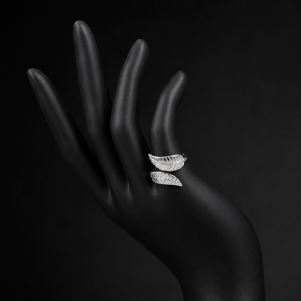 Silver double wing open ring on black hand mannequin