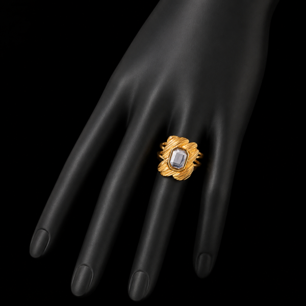 Gold square stone ring on downward black hand