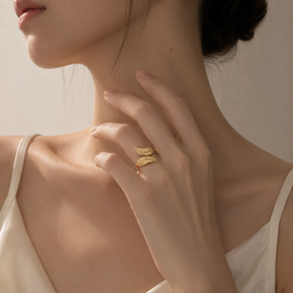 Female model wearing gold double wing open ring