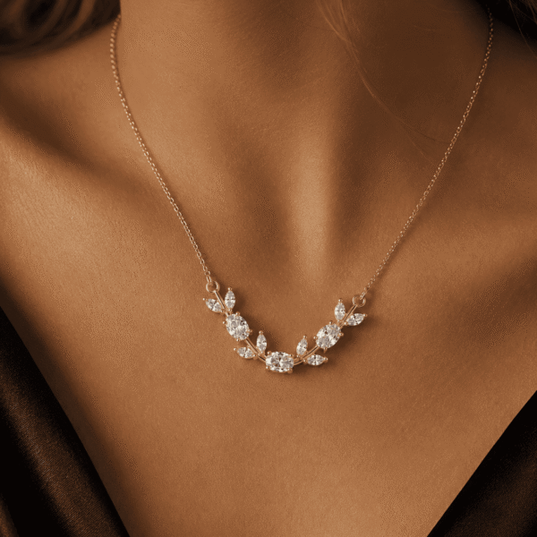 Model wearing a white and clear leaf crystal-style necklace