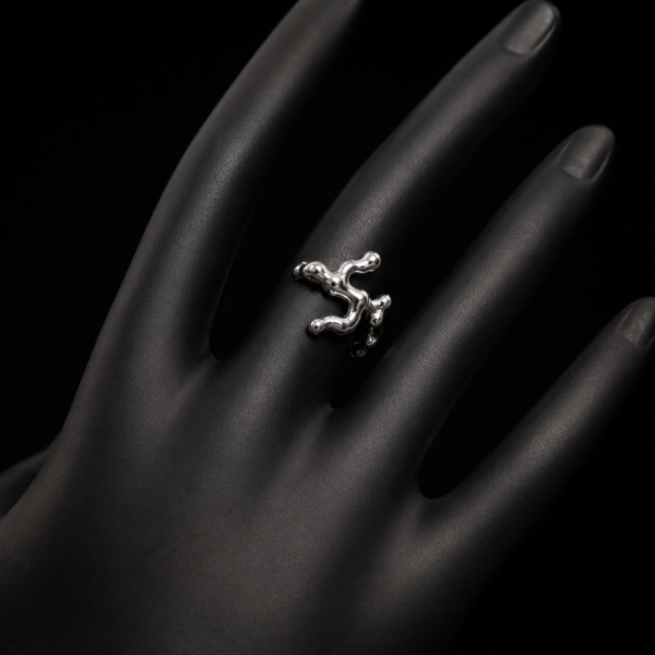 Silver-tone abstract branch open ring worn on a black mannequin hand