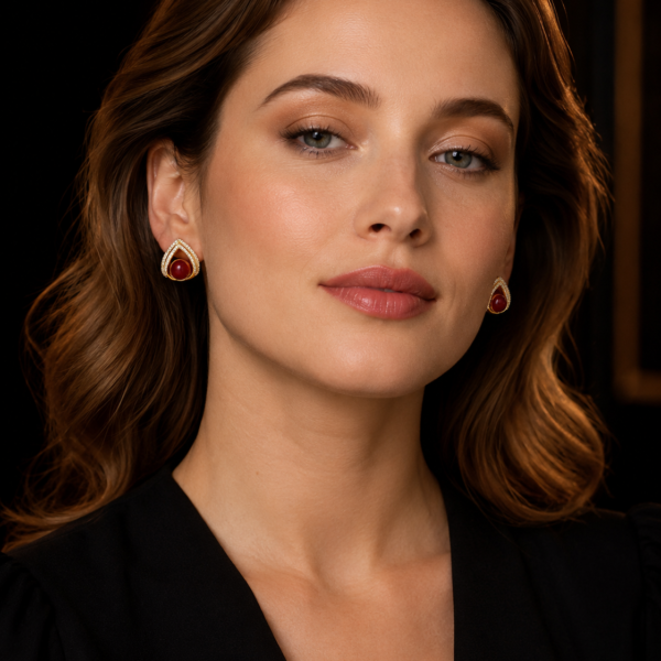 Model wearing vintage red teardrop earrings