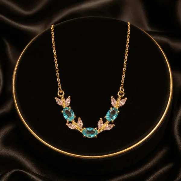 Multicolor butterfly and leaf crystal-style necklace arranged on black fabric
